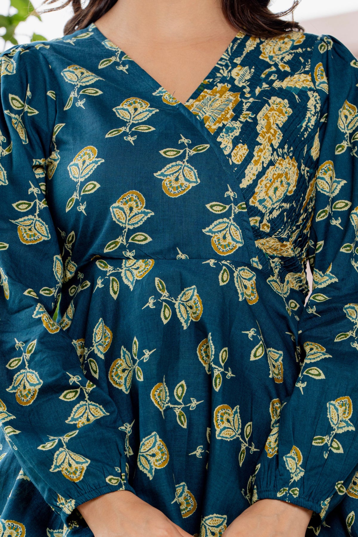 Waist up view of the model wearing the teal blue cotton co-ord set